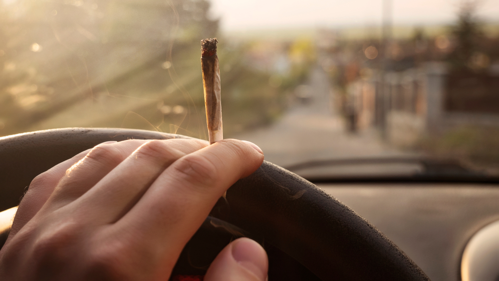 person smoking medical marijuana while driving a vehicle