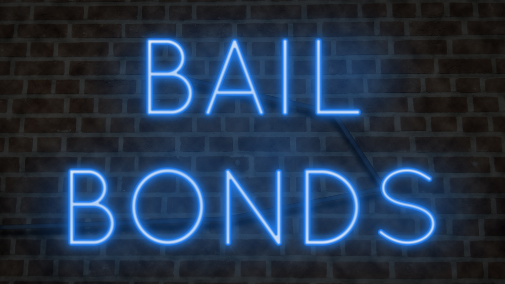 neon sign that says bail bonds