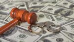 handcuffs, gavel and dollar bills
