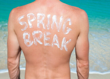 person with sunscreen on back